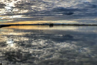 Reflection of clouds in calm lake