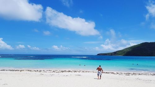 Scenic view of sea against blue sky