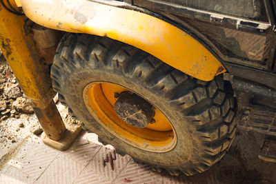 High angle view of yellow car on dirt road
