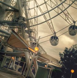 Low angle view of illuminated building against sky