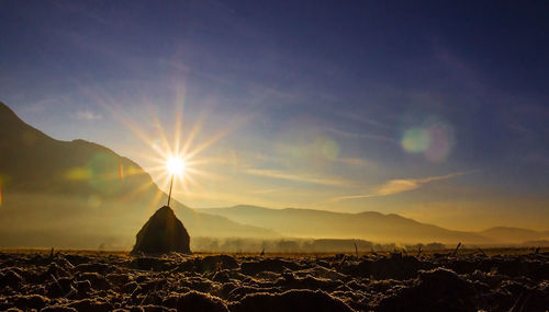 Panoramic view of silhouette landscape against sky during sunset