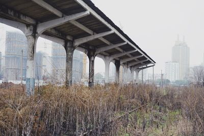 Panoramic view of bridge and buildings against sky