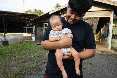 Full length of father and son