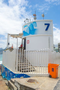 Lifeguard hut on beach against sky