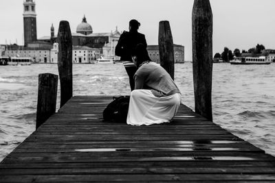 Rear view of man and woman at seaside