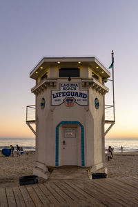 Built structure on beach against clear sky