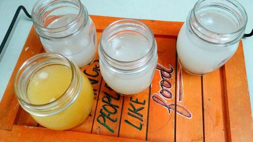 High angle view of glass jar on table