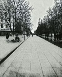 Man sitting on road in winter