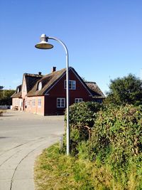 View of buildings against blue sky and clouds