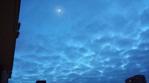 Low angle view of built structure against cloudy sky