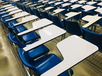 High angle view of empty chairs on table