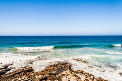 Scenic view of sea against clear sky