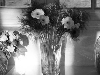 Close-up of flower vase on table at home