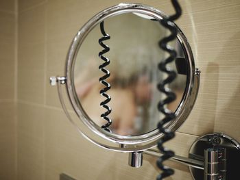 Close-up of mirror on wall