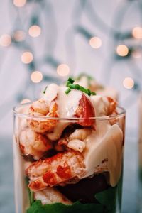 Close-up of prawns in drinking glass on table