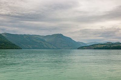 Scenic view of rippled lake against mountain range