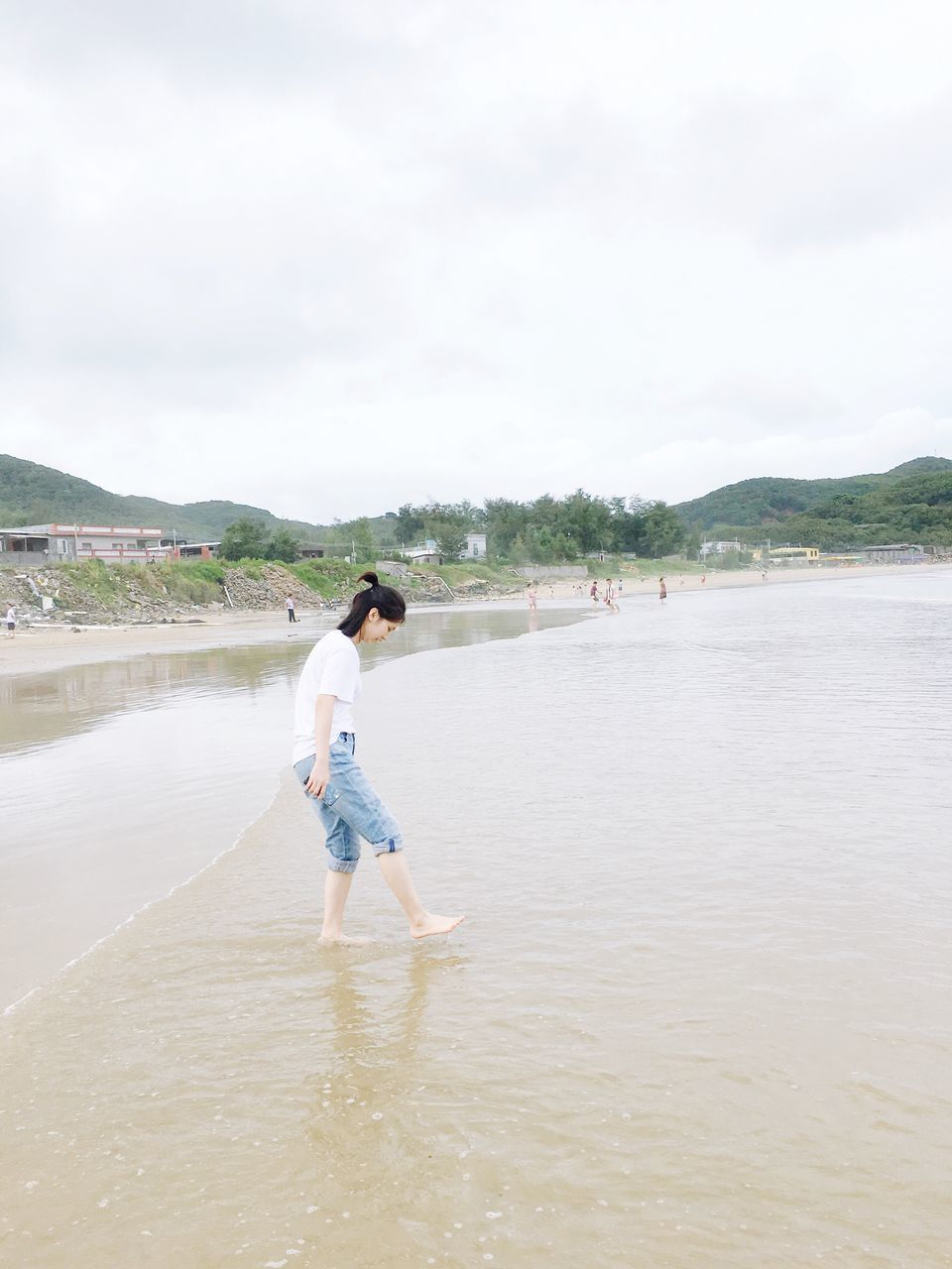 FULL LENGTH OF MAN STANDING IN WATER