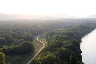 Scenic view of river amidst mountains against sky
