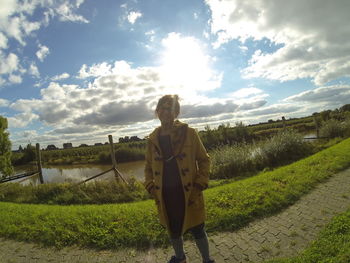 Person standing on grassy field