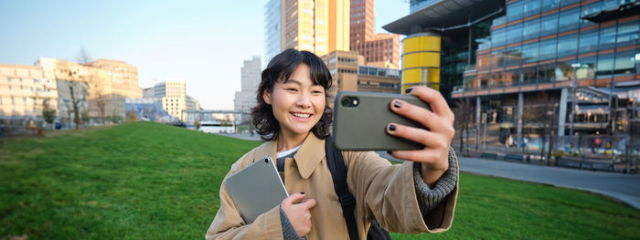 Young woman using mobile phone