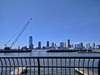 View of suspension bridge with city in background