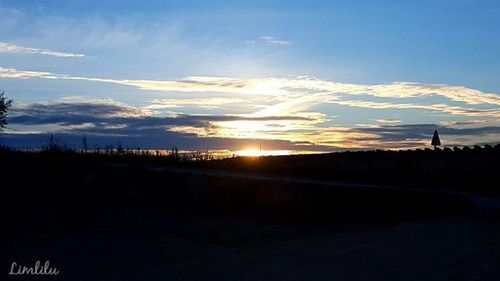 Scenic view of landscape against sky during sunset