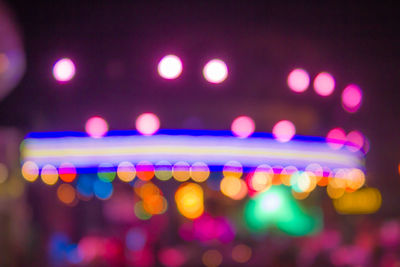 Defocused image of illuminated lights at night