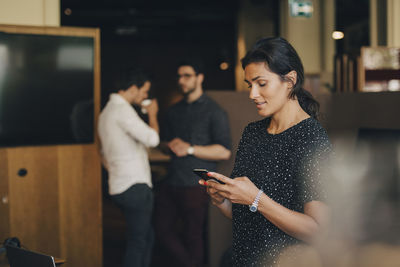 Young woman using mobile phone