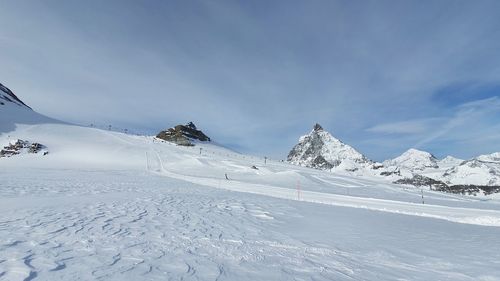 Snow covered mountain against sky