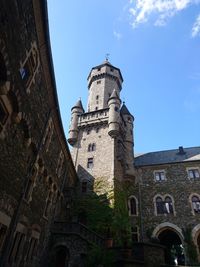 Low angle view of clock tower against sky