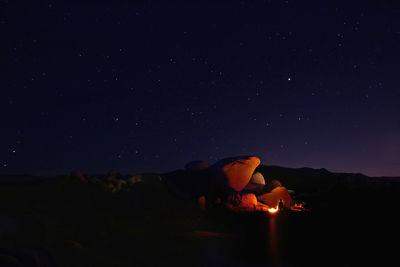 Low angle view of bonfire against sky at night