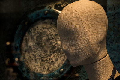 Close-up of mannequin covered with fabric