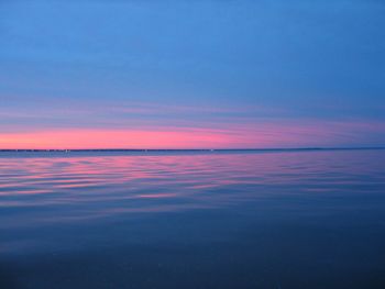 Scenic view of sea against sky at sunset