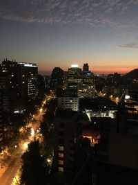 Aerial view of city lit up at night