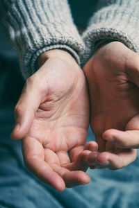 Close-up of hands touching baby