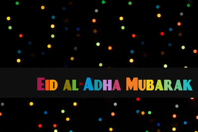 Low angle view of illuminated text at night