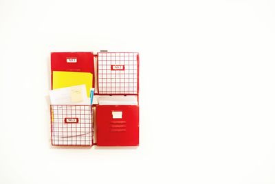 Red telephone booth against white background