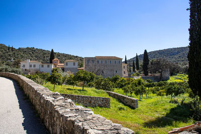 View of old ruins against clear blue sky