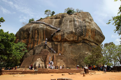 People climbing on rock formation