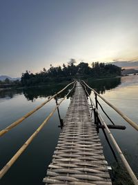 Scenic view of bridge against sky during sunset