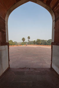 Archway against clear sky seen through arch