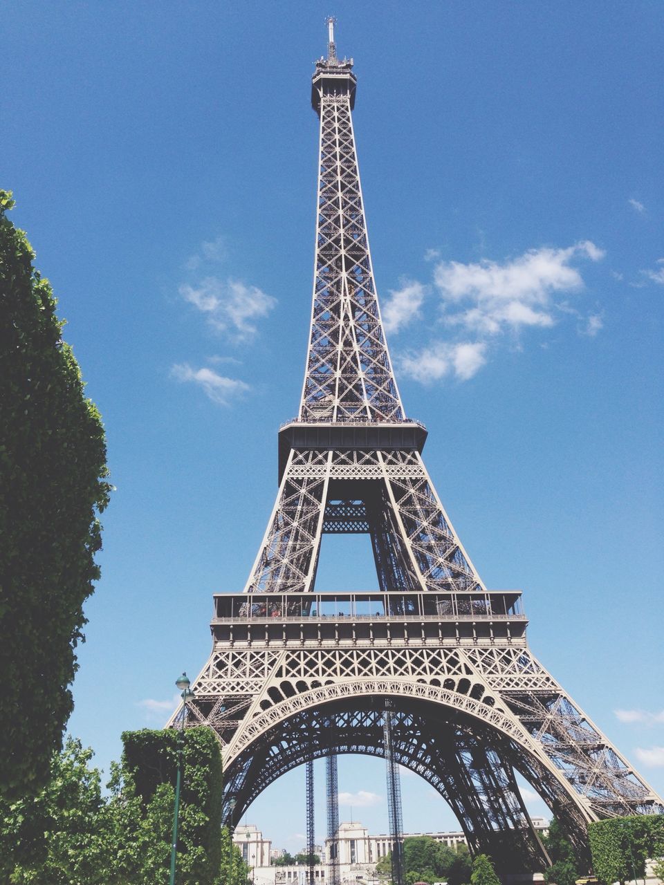 eiffel tower, architecture, built structure, low angle view, tower, famous place, international landmark, metal, culture, travel destinations, tall - high, sky, tourism, capital cities, travel, history, tree, metallic, architectural feature, day