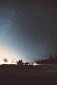 Scenic view of lake against sky at night