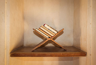 Close-up of books on wooden plank