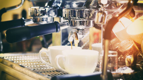 Close-up of pouring coffee from espresso maker