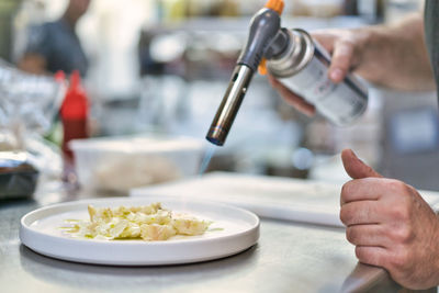 Close-up of person preparing food