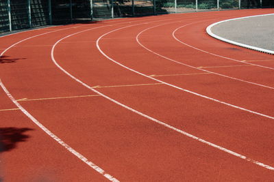 High angle view of empty running track during sunny day