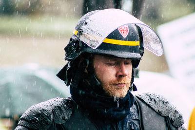 Portrait of man in snow during rainy season