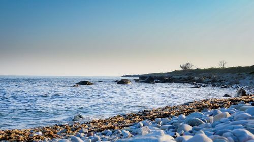 Scenic view of sea against clear sky