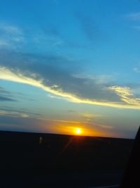 Silhouette landscape against sky during sunset